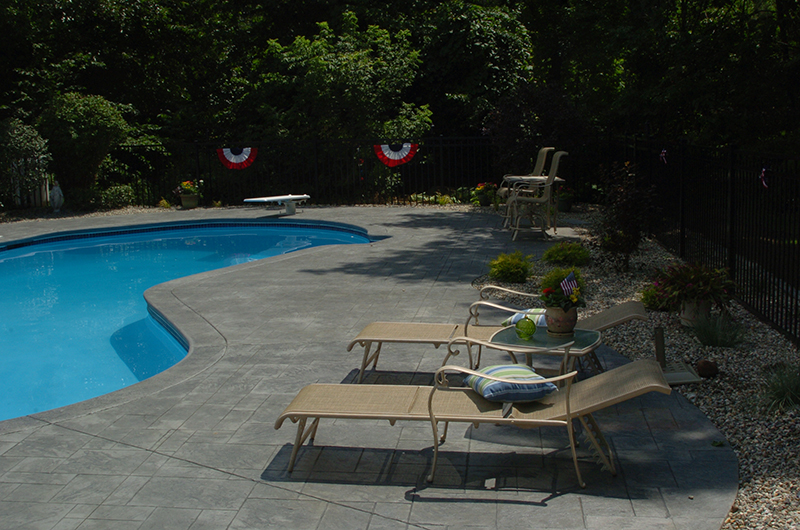 Swimming pool and stamped concrete project example 95